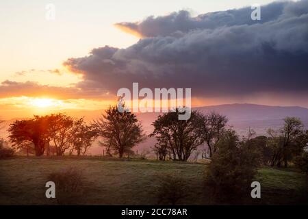 Evening light over the countryside of the northern Cotswolds from Middle Hill near Broadway, Worcestershire, England, UK Stock Photo