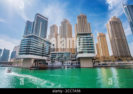 Dubai marina water canal with promenade and modern buildings, UAE. Luxury travel concept. Stock Photo