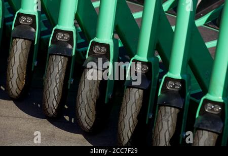 Bucharest, Romania - August 10, 2020: Bolt electric scooters are parked on a sidewalk in Bucharest. This image is for editorial use only. Stock Photo