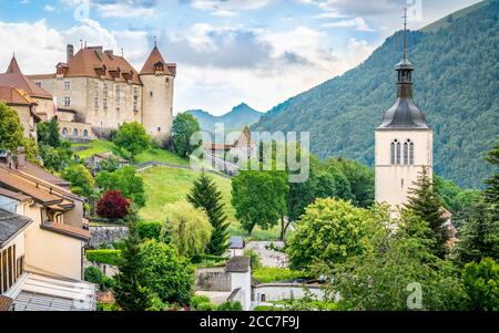 Panorama of Gruyeres medieval village with the castle houses and Saint Theodule church bell tower in La Gruyere Fribourg Switzerland Stock Photo