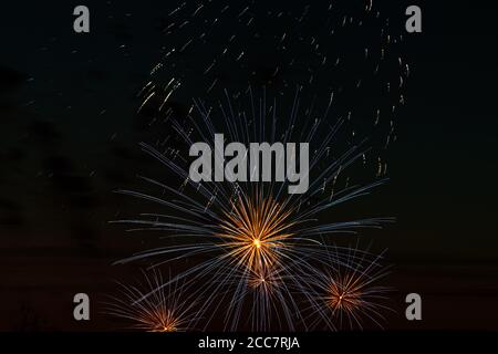 Bright multi-colored fireworks on a festive night. Explosions of colored fire in the sky. Stock Photo