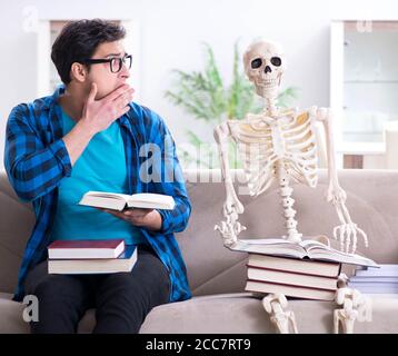 The student studying with skeleton preparing for exams Stock Photo