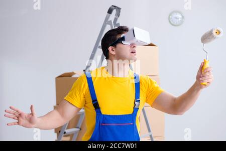 The painter contractor working with virtual reality goggles Stock Photo