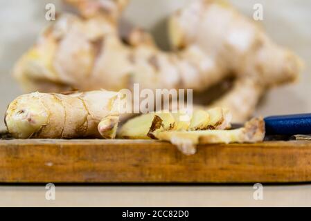 Ginger root. Ginger has a spicy flavor and can be used in both savory and sweet dishes and in several forms: fresh, dry, preserved or crystallized. Stock Photo