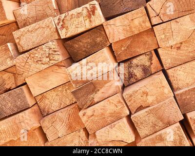 Stack of lumber boards background or texture concept. Stock Photo