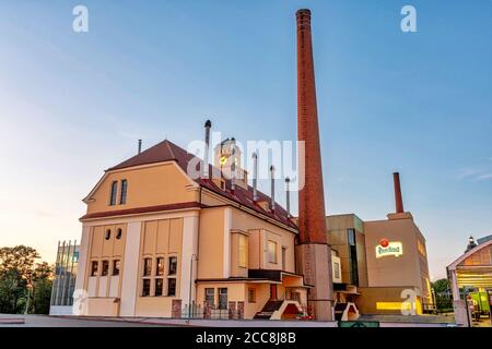 Pilsen, Czech Republic - August 8, 2020: View of the historic Pilsner Urquell brewery buildings. The company logo is clearly visible. Stock Photo