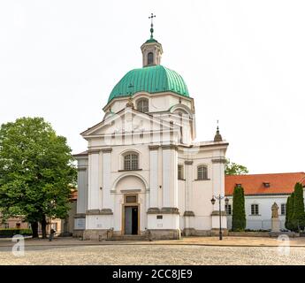 Warsaw, Poland - May 22, 2020: The roman catholic St. Kazimierz Church at New Town of Warsaw. View of St. Casimir's Church from the New Town Square. Stock Photo