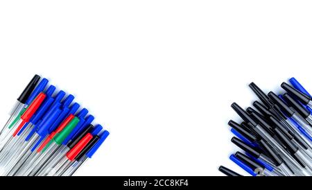 Pile of a lot multi colored plastic ballpoint pens isolated on white background. Abstract stationery background. 16x9 format. Top view. Close-up. Many Stock Photo