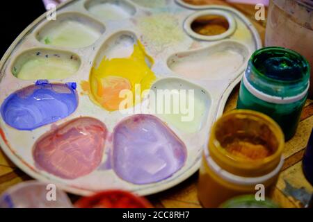 artist palette and multi colored gouache close up. Stock Photo