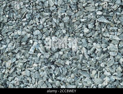 blue metal or Construction aggregate, or simply aggregate, is a broad category of coarse- to medium-grained particulate material used in construction Stock Photo