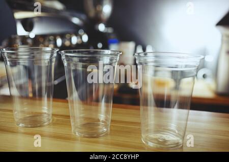 https://l450v.alamy.com/450v/2cc8yhp/empty-disposable-plastic-cups-for-cocktail-milkshake-and-other-beverage-in-cafe-blurred-image-selective-focus-2cc8yhp.jpg