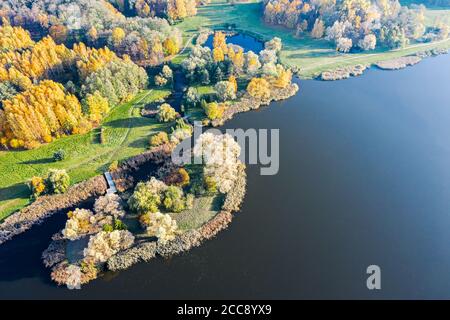 aerial drone view of colorful autumn landscape with lake and small island Stock Photo