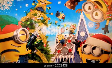 Close up of Christmas version of HAPPY MINION statue in Universal Studios Japan. Minions are famous character from Despicable Me animation. Stock Photo