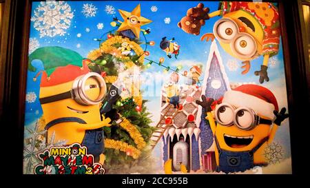 Close up of Christmas version of HAPPY MINION statue in Universal Studios Japan. Minions are famous character from Despicable Me animation. Stock Photo