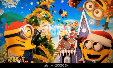 Close up of Christmas version of HAPPY MINION statue in Universal Studios Japan. Minions are famous character from Despicable Me animation. Stock Photo