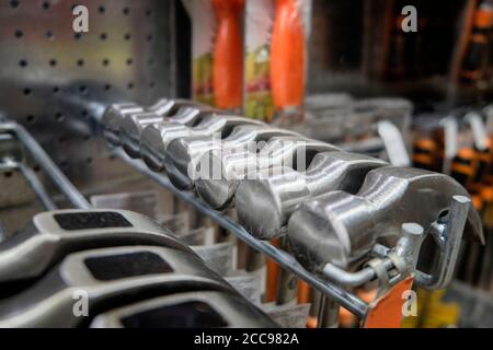 Rows of brand new metal hammer heads. Stock Photo
