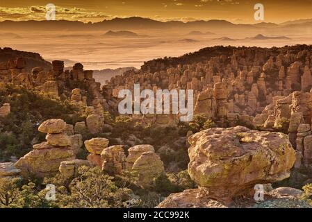 View from Massai Point at Chiricahua National Monument with Sulphur Spring Valley Dragoon Mountains in far distance, Arizona, USA Stock Photo