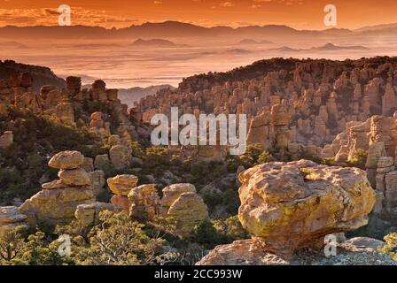 View from Massai Point at Chiricahua National Monument with Sulphur Spring Valley Dragoon Mountains in far distance, Arizona, USA Stock Photo
