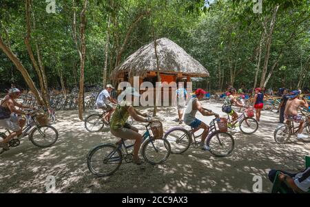 COBA, MEXICO - Jul 25, 2019: Visitors to Mexico's Zona Arqueologica de Coba rent and explore the sprawling grounds by bicycle. Stock Photo