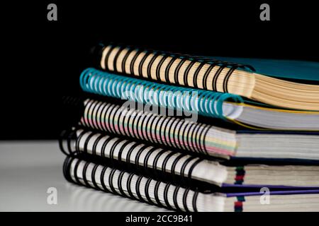 pile of spiral wire notebooks Stock Photo