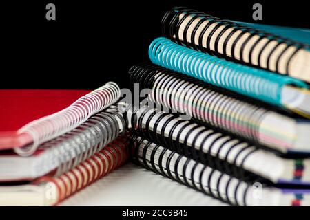 pile of spiral wire notebooks Stock Photo