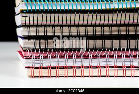pile of spiral wire notebooks Stock Photo