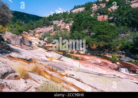 La Pedriza National Park on the southern slopes of the Guadarrama mountain range in Madrid, with cascades. It is one of the largest granitic ranges Stock Photo