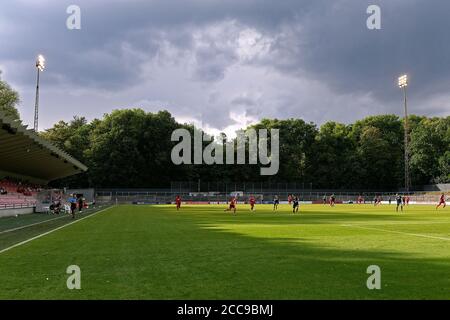Soccer match in the Franz Kremer Stadium under a dramatic sky. Stock Photo
