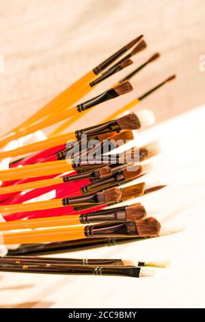 Paint brushes set, close-up. Marketing photo. white background, Studio shot.On the table. Stock Photo