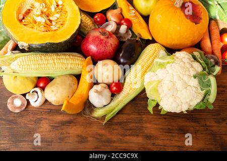 Various fruits and vegetables on wooden background - top view Stock Photo