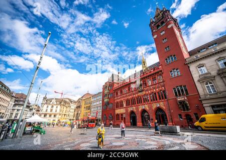 Basel Switzerland , 29 June 2020 : Extreme wide angle view of Basel town hall and market place with people in Basel old town Switzerland Stock Photo