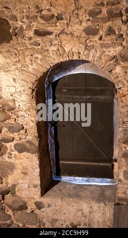 Old  Wooden Window in the Church and Wall From Stones Stock Photo