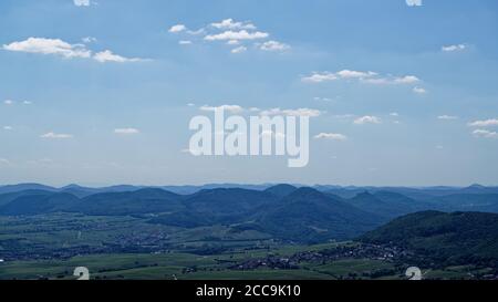 The hillside to the palatinate forest is called Haardt. The plain is Rhine Valley.  In the distance is the top hill castle Trifels near Annweiler. Stock Photo