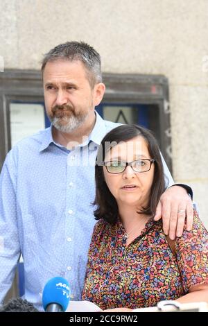Stuart Murray with his wife Figen Murray, the mother of 29-year-old Martyn Hett, a victim of the Manchester Arena bombing, speak to the media outside the Old Bailey after terrorist Hashem Abedi was handed a record-breaking 55-year minimum term. Stock Photo