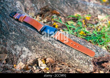 Leather smart watch band craftsmanship working object in nature background Stock Photo