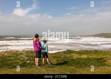 Garrettstown, Cork, Ireland. 20th August, 2020. Deirdre and Ruby Garry from Tullamore take a look at the power of the Wild Atlantic Way after Storm Ellen at Garrettstown, Co. Cork, Ireland. - Credit; David Creedon / Alamy Live News Stock Photo