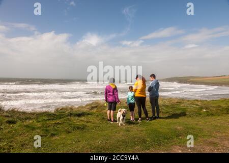 Garrettstown, Cork, Ireland. 20th August, 2020.Deirdre, Ruby, Noelle and Jamie Garry with Toffie the dog from Tullamore take time to view the power of the Wild Atlantic Way after Storm Ellen in Garrettstown, Co. Cork, Ireland.  - Credit; David Creedon / Alamy Live News Stock Photo