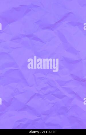 Textured crumpled purple paper background. Vertical Stock Photo