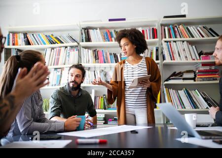 Creative managers crew working with new startup project in office. Team brainstorming. Stock Photo