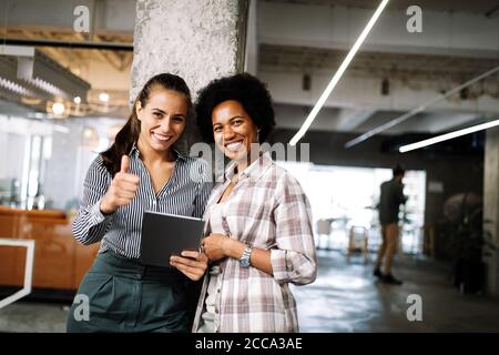 Portrait of business people, architects having discussion in office Stock Photo