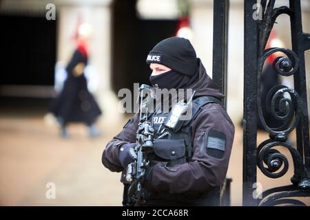 Armed police officer outside Horse Guards in Whitehall, London. Stock Photo