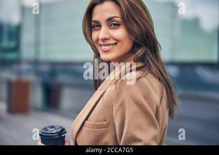 Stylish lady with a happy smile posing for the camera Stock Photo