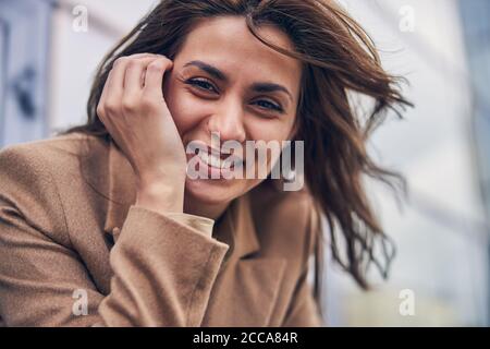 High-spirited pretty lady looking in front of her Stock Photo