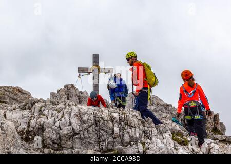 Italy - Veneto - Girl with mountain guide on the top of Monte Paterno at the end of the via ferrata Stock Photo