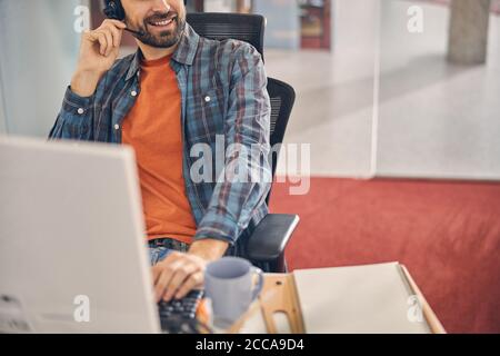 Male customer service operator working in office Stock Photo