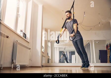Professional young sportsman is doing functional workouts Stock Photo