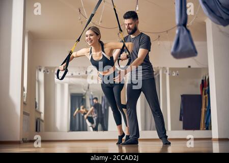 Woman working out with a personal coach Stock Photo