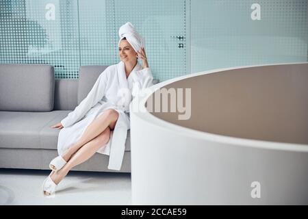 Spa client relaxing before a cosmetic procedure Stock Photo