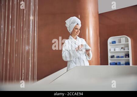 Dreamy lady holding a cup of tea Stock Photo