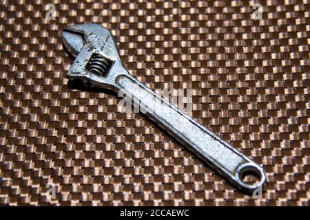 The wrench is widely used by the plumber or by someone who likes to do repairs at home. It is used in the placement of taps and has adjustment, which Stock Photo